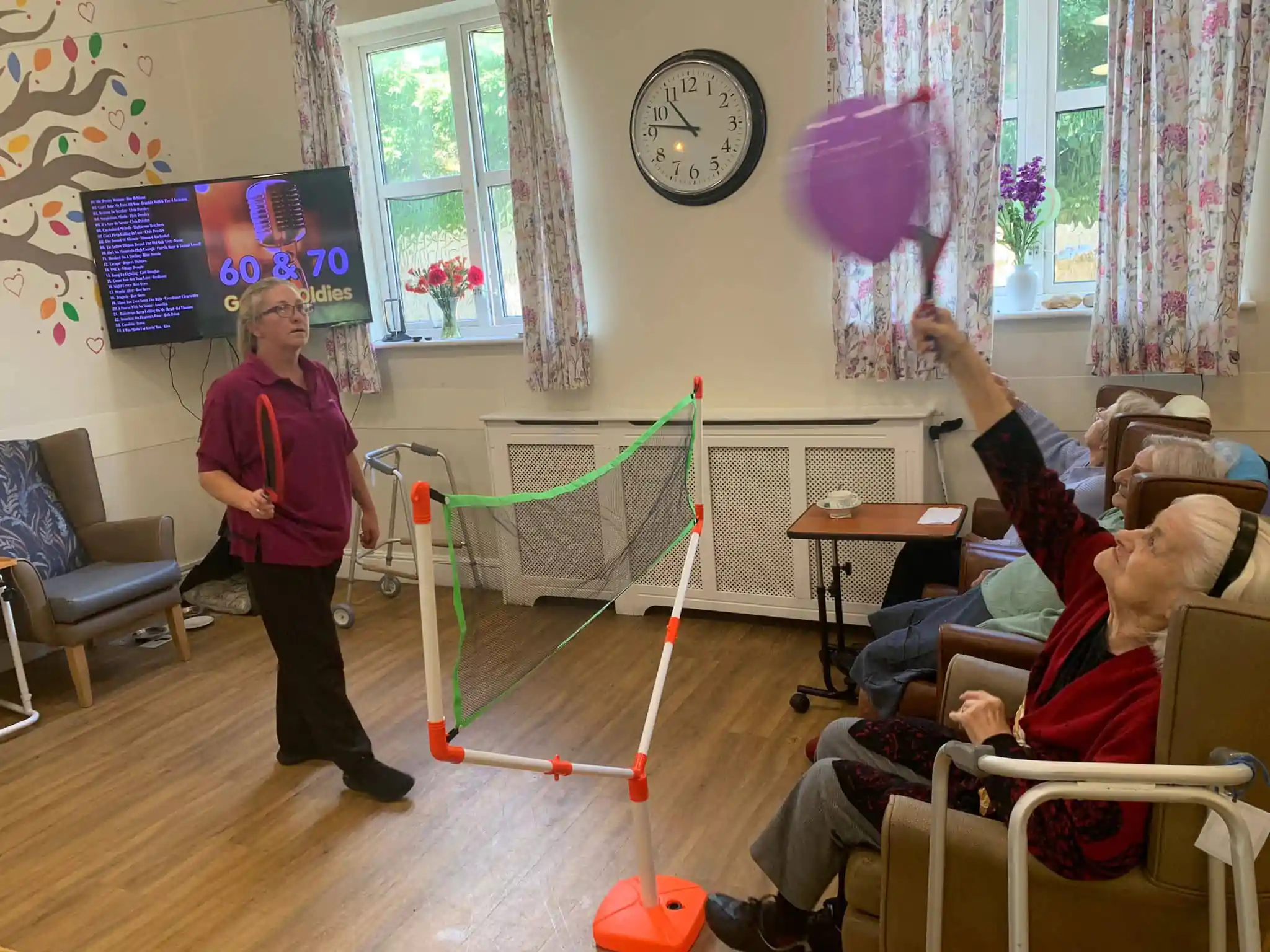 Residents and staff playing indoor sports games