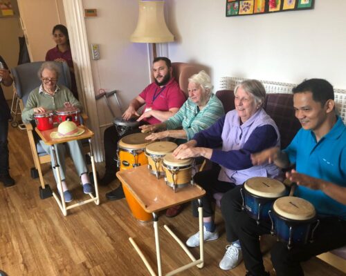 Residents enjoying a drumming workshop