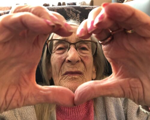 Resident creates a heart facing camera