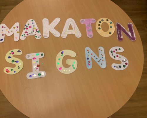 Makaton sign on a round table