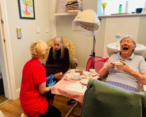 Having fun in the hairdressers whilst enjoying tea and biscuits