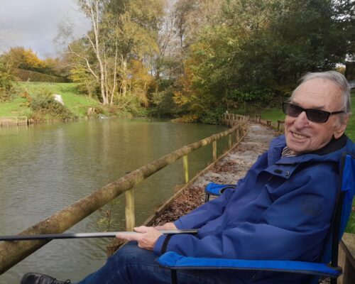 Resident smiling while fishing